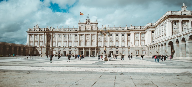 Tourists in front of Tthe Royal Palace in Madrid.