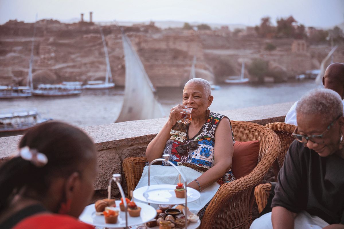 River cruise travelers enjoying an outdoor dining experience